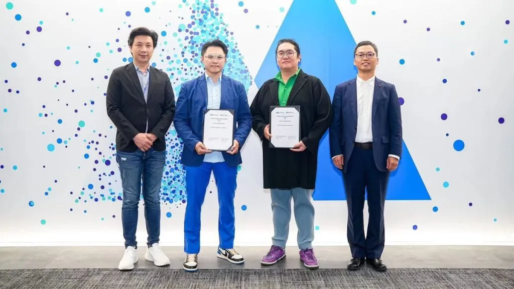 People holding certificates after business ceremony