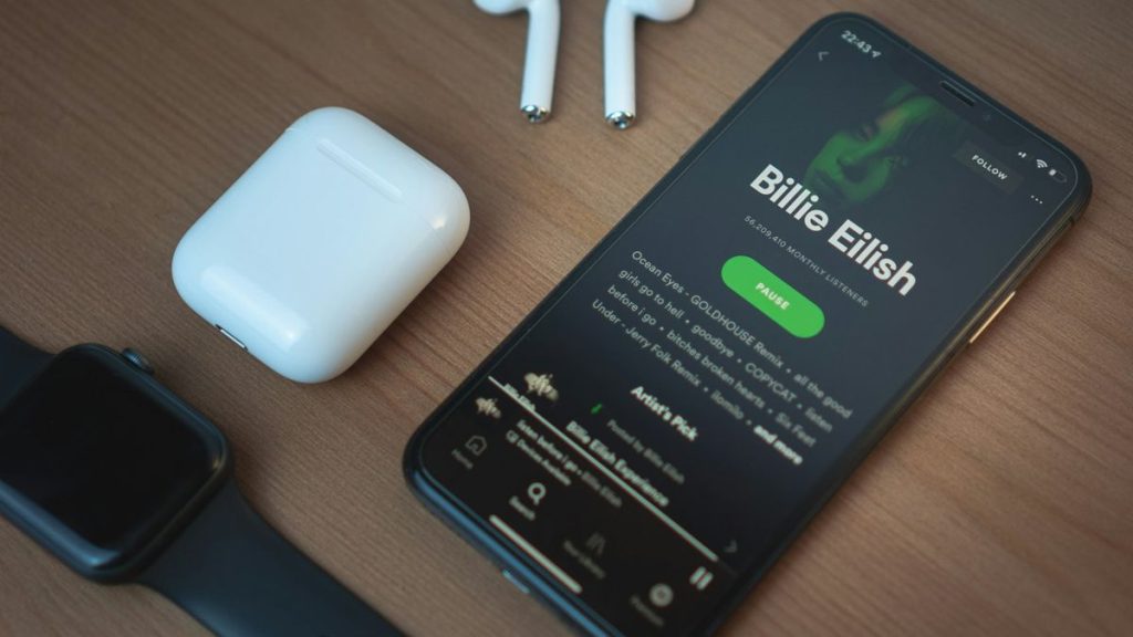 AirPods and phone on Spotify screen