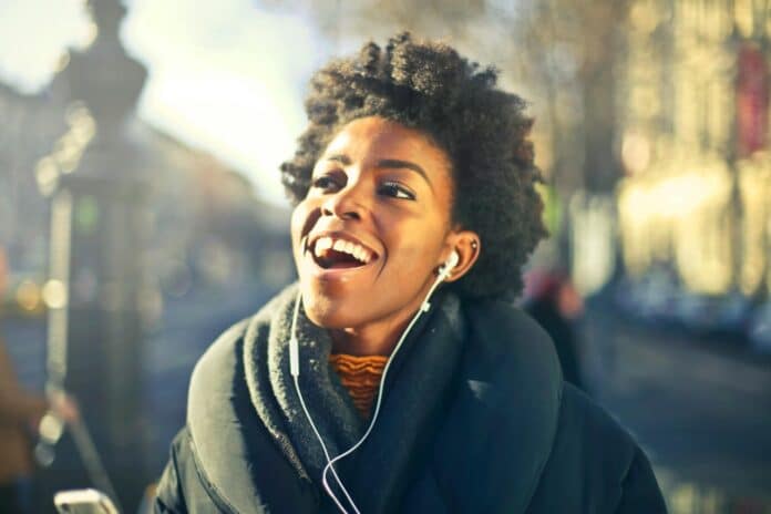 Woman listening to music with earbuds