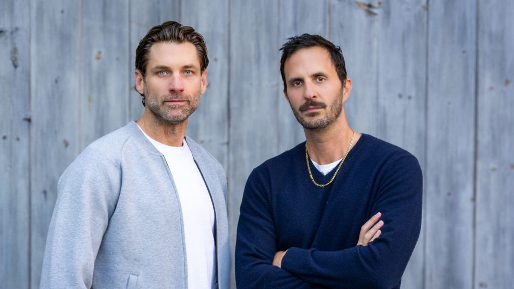 Two businessmen standing together indoors