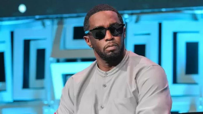 Sean Combs wearing beige shirt