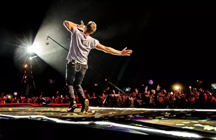 Coldplay performing live concert on stage