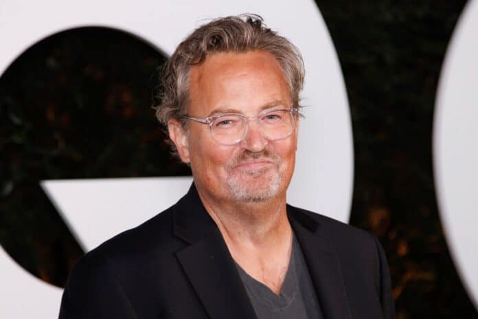 Matthew Perry smiling at camera