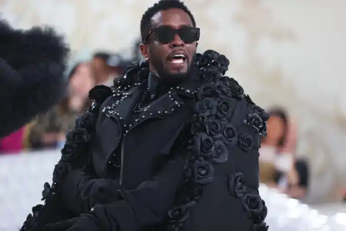 Diddy in black jacket, serious expression