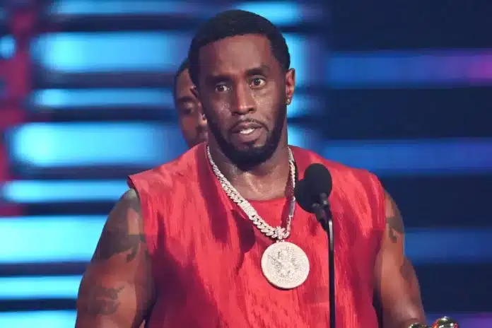 Diddy speaking at microphone