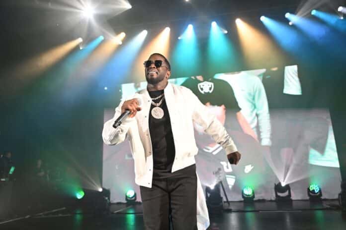 Diddy performing on stage with mic