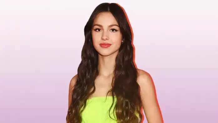 Olivia Rodrigo posing with dark hair