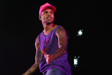 Chris Brown in pink baseball cap