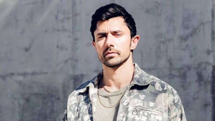 KSHMR wearing camo jacket