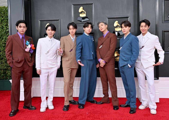 Alt text: BTS posing at awards ceremony