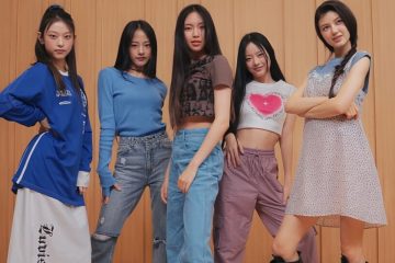 Five members of NewJeans posing together