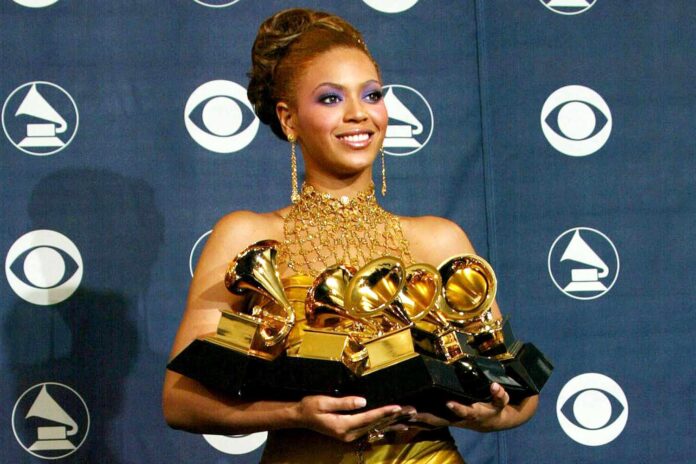 Beyoncé holding Grammy awards