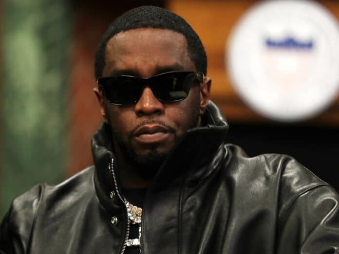 Diddy wearing black jacket and sunglasses