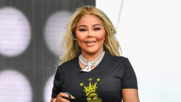 Lil Kim wearing black