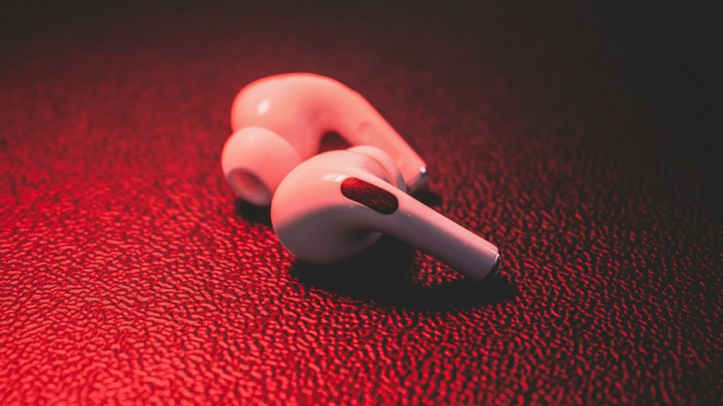 AirPods Pro on red surface