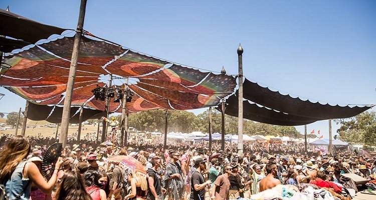 Festival crowd under outdoor tent