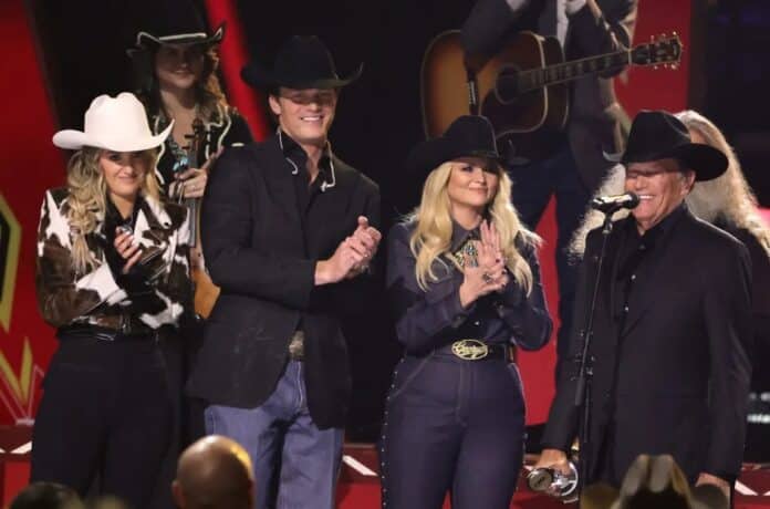 Group receiving CMA Awards on stage