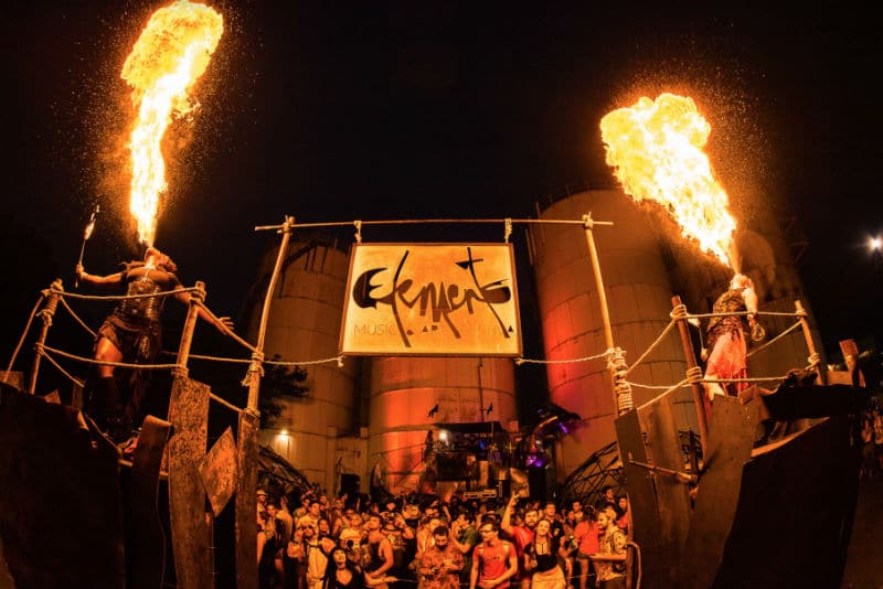 Festival crowd watches fire dancers