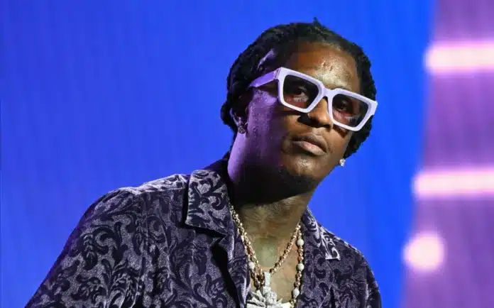 Young Thug wearing sunglasses and jewelry