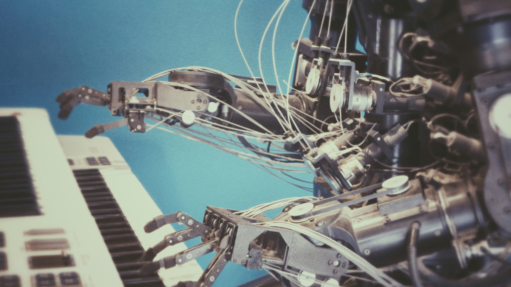 Robot arm plays keyboard instrument