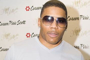 Nelly at media event backdrop