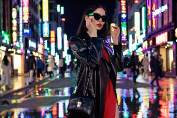 Woman walking in rainy city night