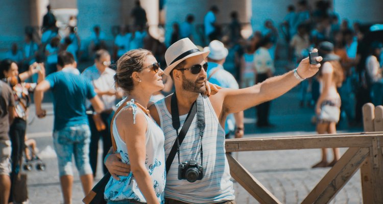 Tourists taking selfie together