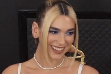 Dua Lipa smiling at camera