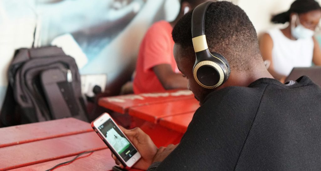 Man streaming music on smartphone