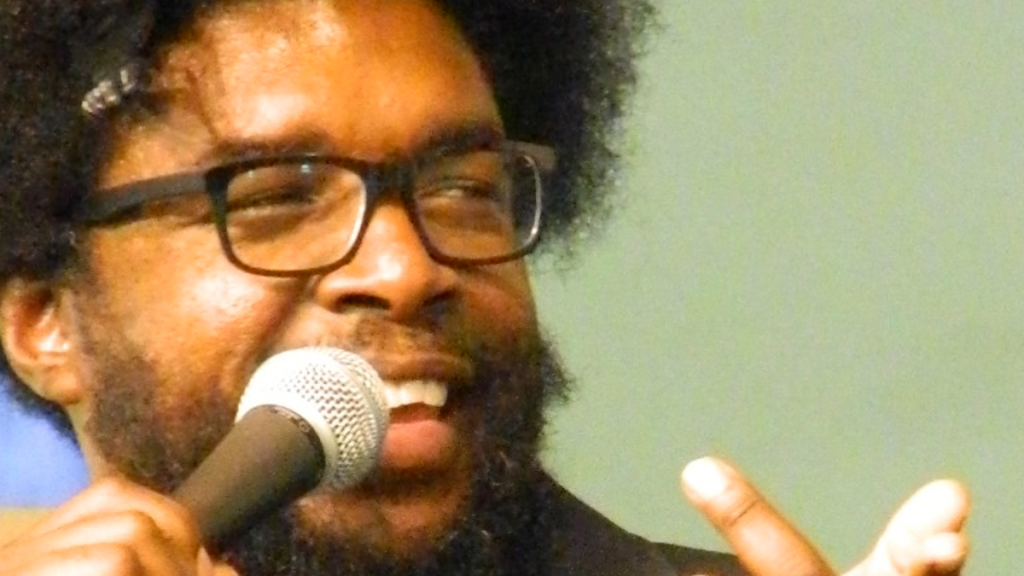 Questlove speaking into microphone