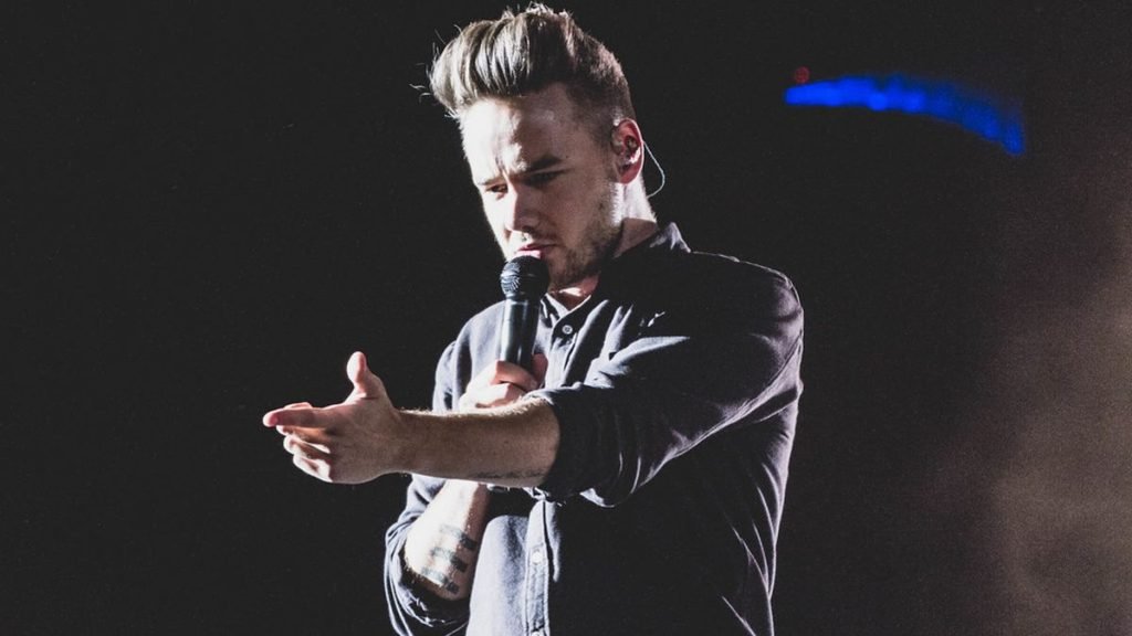 Liam Payne performing with microphone