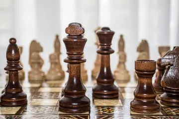 Chess pieces on wooden board