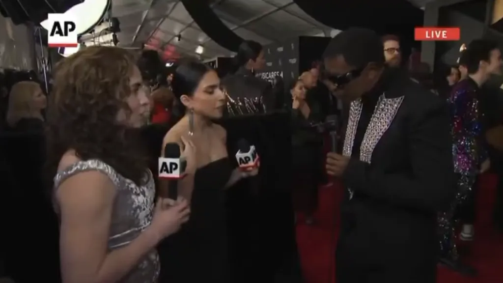 Three people on red carpet