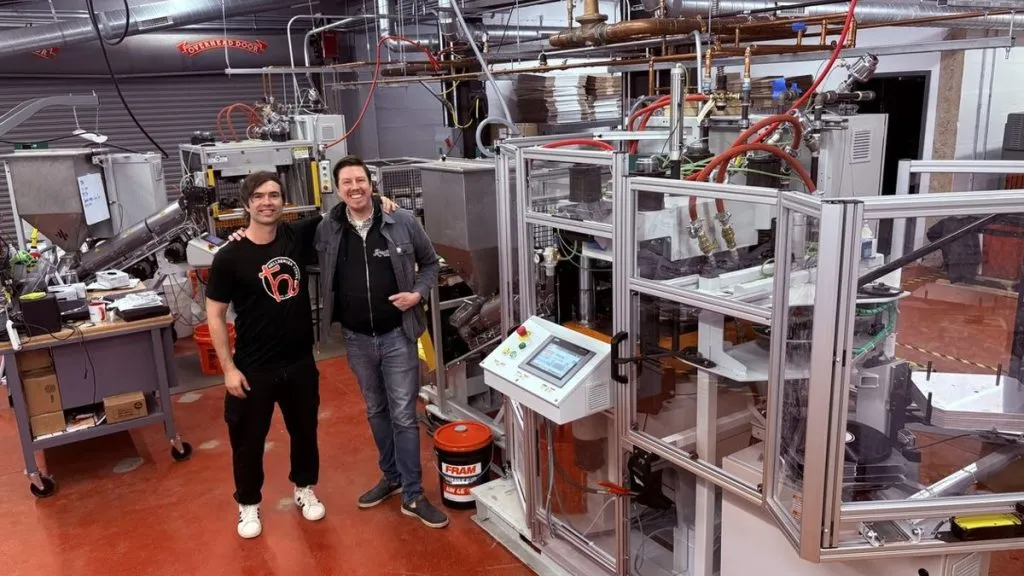 Two men at vinyl pressing plant