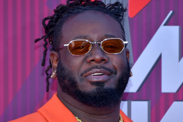 T-Pain with Harbourview logo behind him