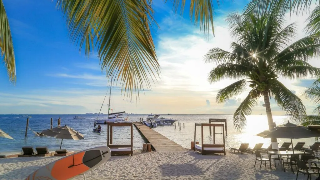 Tropical beach with wooden dock