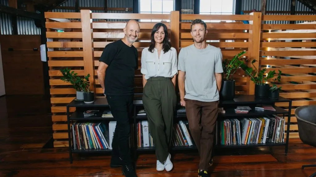 Three executives at record store display